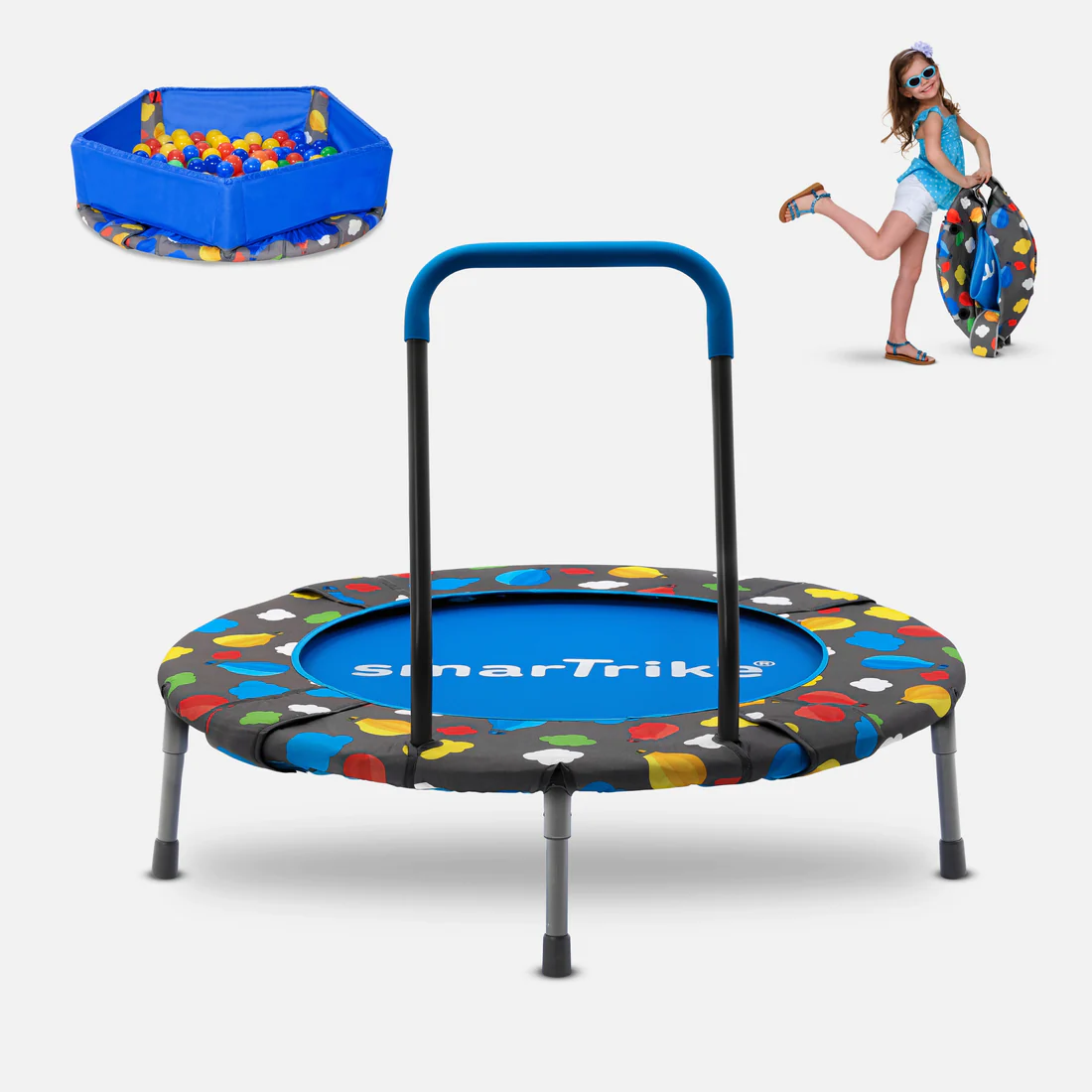 a little girl is playing with a trampoline