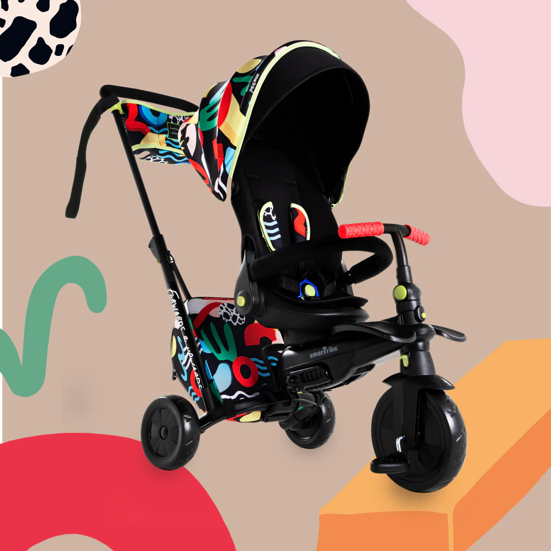 A child's tricycle with a colorful design on it