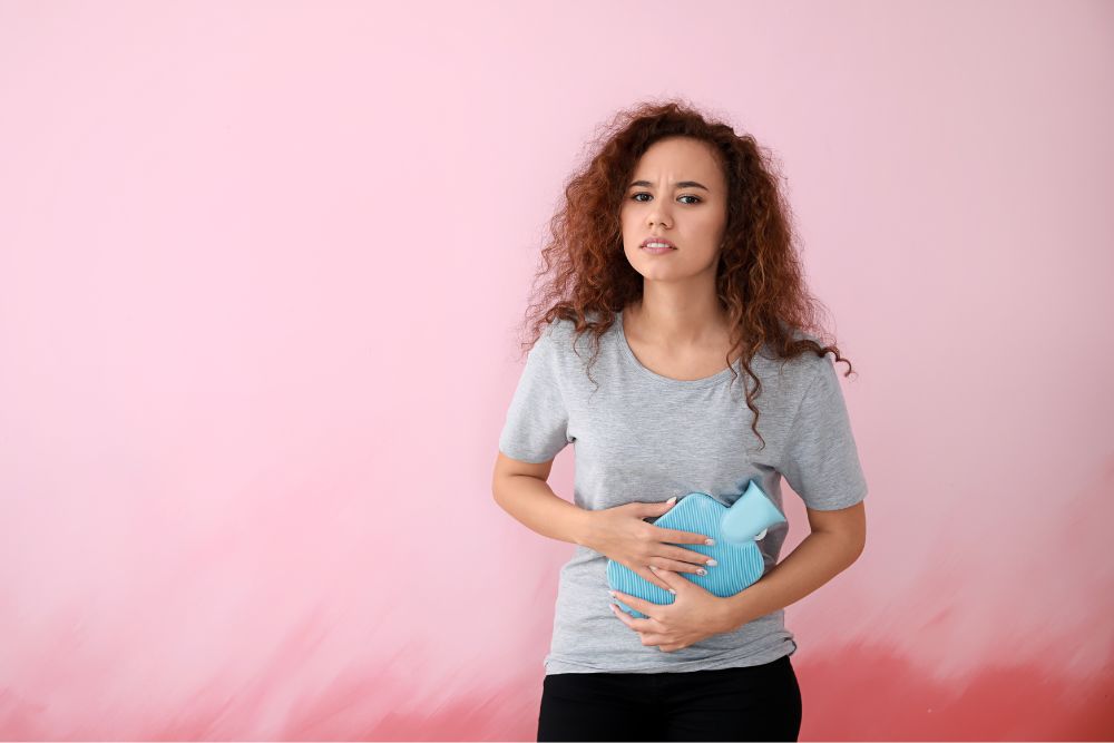 a woman holding a blue object in her hands