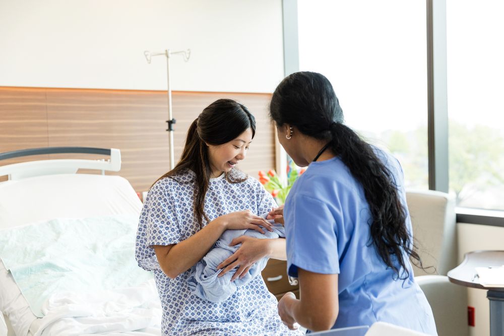 Midwife and baby 