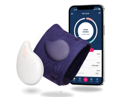 an iphone and a purple wristband with a white device next to it