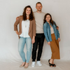 a group of three people standing next to each other