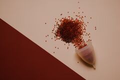 a pile of red stuff sitting on top of a white table