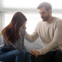 a man and a woman sitting on a couch