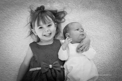 a black and white photo of two children