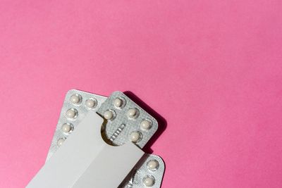 a close up of a contraption on a pink background
