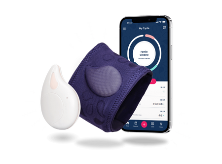 a cell phone with a purple wristband and a white earplug