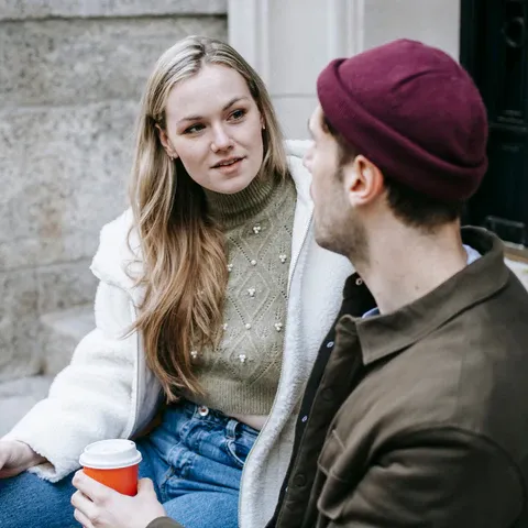 a man and a woman sitting next to each other