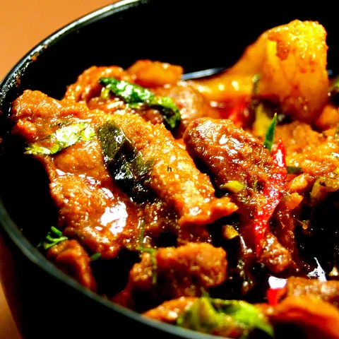 a close up of a bowl of food on a table