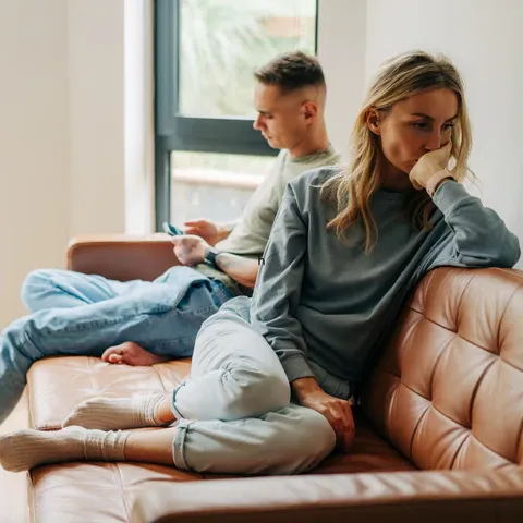 a man and a woman sitting on a couch