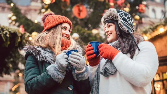 a couple of women standing next to each other