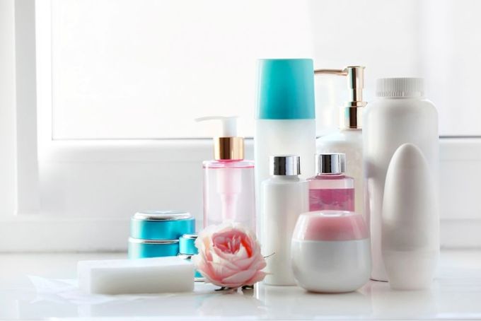 a white counter topped with lots of different types of cosmetics
