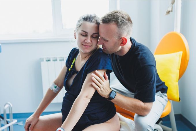 a man and a woman sitting next to each other