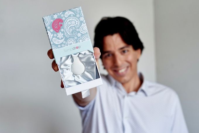 Michael holding Tempdrop  basal body temperature thermometer