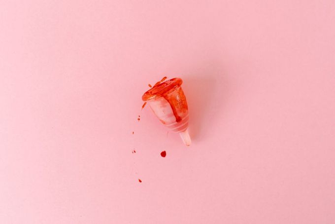 a piece of food that is on a pink surface