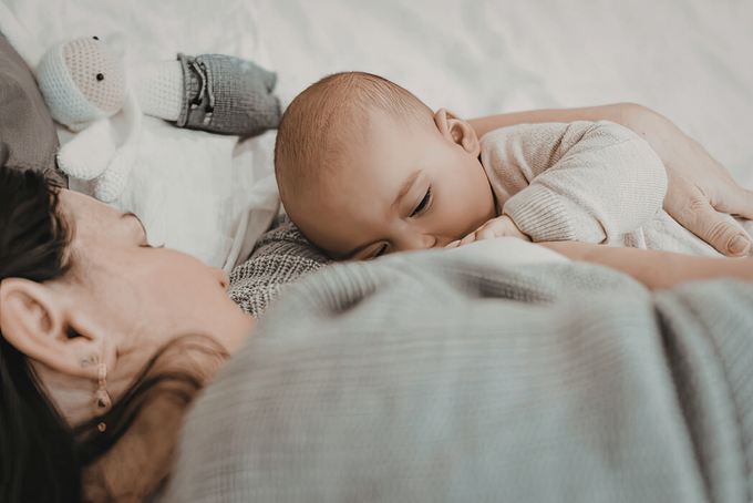The Golden Month - Importance of rest A mother napping with her baby as part of her TCM routine