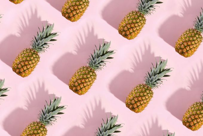 a pattern of pineapples on a pink background