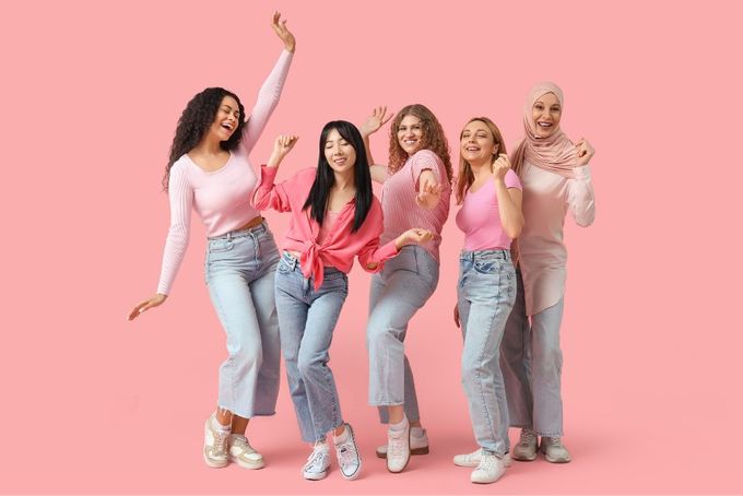 a group of women standing next to each other