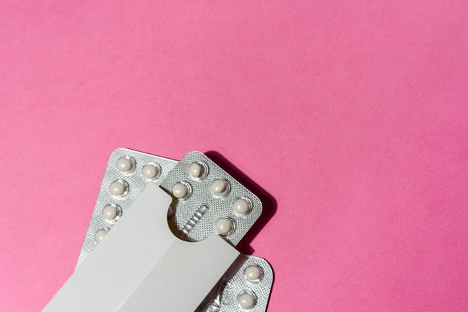 a close up of a contraption on a pink background