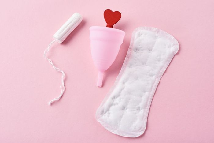 a pink object with a red heart on top of it