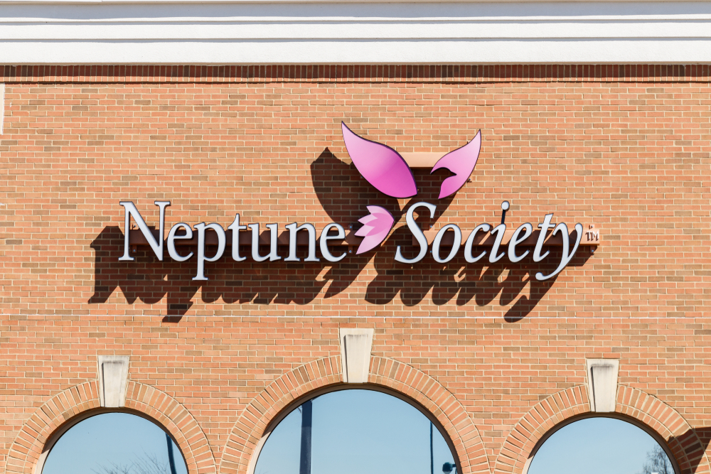 Neptune Society logo and sign outside brick building