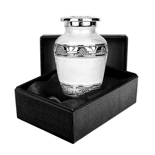 Silver Linings White Small Keepsake Urn A stock image of a white urn with silver detailing in a black box