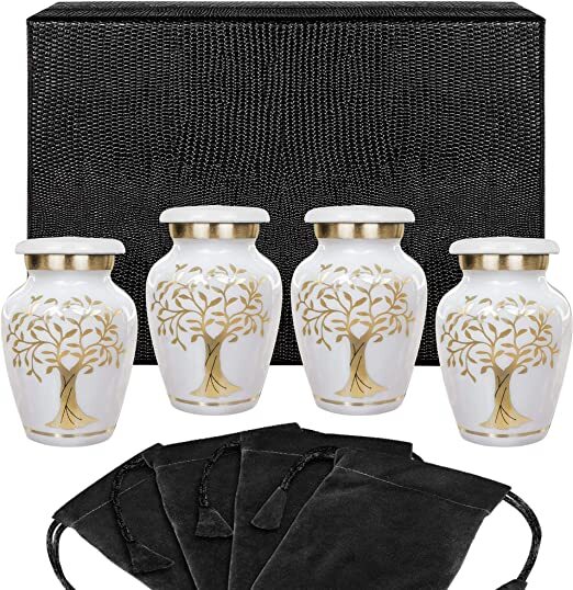 A set of four white urns depicting a gold tree of life with 4 black velvet bags