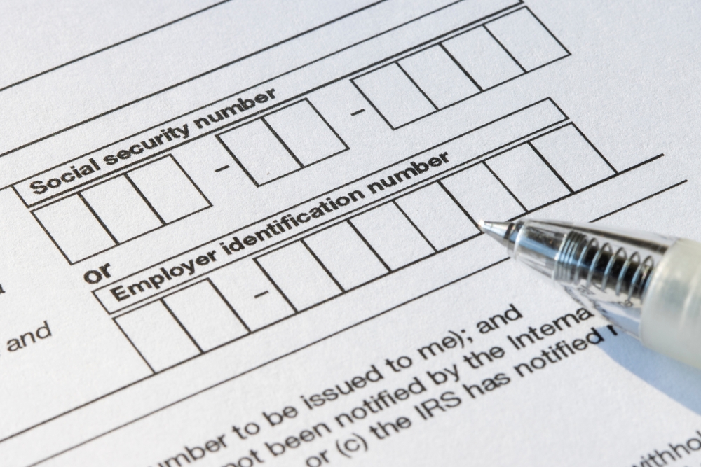 A form featuring fillable boxes for both a social security number and an employer identification number.