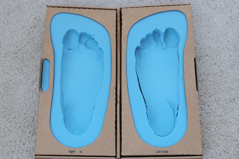 An impression kit for insoles, featuring a bright blue mould.