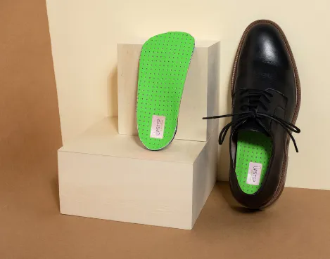 Upstep's Everyday shoe orthotics presented out of the shipping box and in a shoe