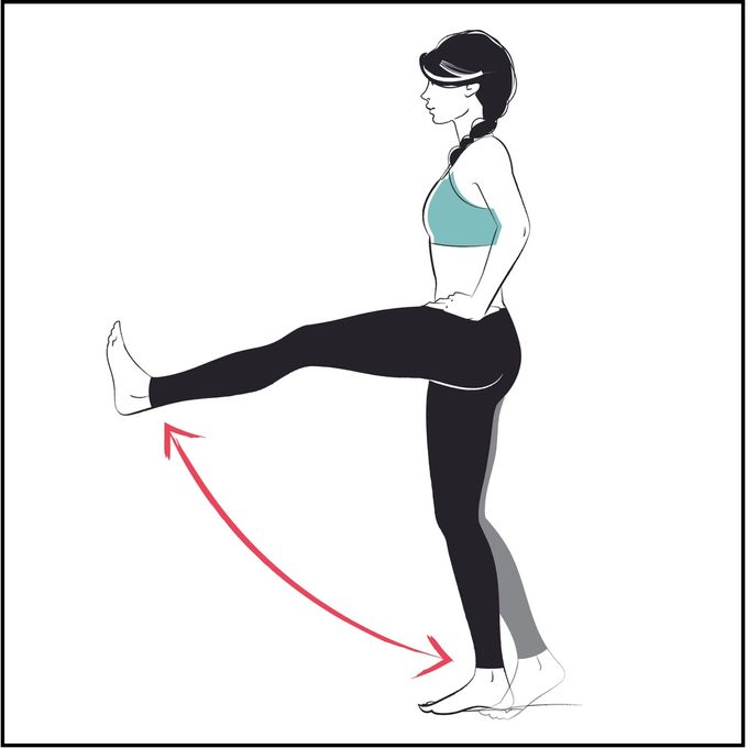 Woman demonstrating how to perform straight leg raises while standing