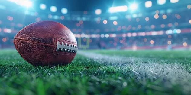 a football sitting on top of a lush green field